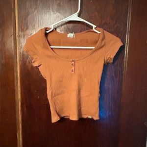 Worn a few times. Too small for me. Super cute shirt.